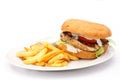 Grilled chicken burger with chips on white plate. Royalty Free Stock Photo