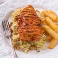 Grilled chicken, cabbage salad with nuts and chips Royalty Free Stock Photo