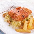 Grilled chicken, cabbage salad with nuts and chips Royalty Free Stock Photo