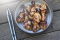 Grilled chicken drums with mushrooms. BBQ background. Summer barbeque