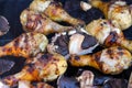 Grilled chicken drums with mushrooms. BBQ background. Summer barbeque.