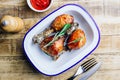 Grilled chicken drumstick bbq with rosemary on a rustic wooden background Royalty Free Stock Photo