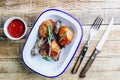 Grilled chicken drumstick bbq with rosemary on a rustic wooden background Royalty Free Stock Photo