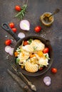 Grilled chicken fillet and various vegetables on a cast-iron frying pan. Copy space, top view flat lay background Royalty Free Stock Photo