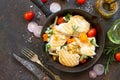 Grilled chicken fillet and various vegetables on a cast-iron frying pan, top view flat lay background Royalty Free Stock Photo