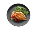 Grilled chicken fillets with tomatoes and arugula isolated on white, top view Royalty Free Stock Photo