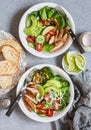 Grilled chicken and fresh vegetable salad. Healthy diet food concept. On a light background Royalty Free Stock Photo