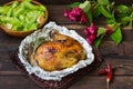 Grilled chicken ham marinated in balsamic sauce, spicy Italian herbs and fresh lemon. Restaurant supply on a wooden Royalty Free Stock Photo