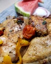 Grilled chicken with hot spices and vegetables - red cherry tomato, sweet pepper Royalty Free Stock Photo