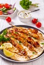 Grilled chicken skewers with flatbreads, top view Royalty Free Stock Photo