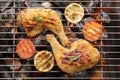 Grilled chicken leg over flames on a barbecue Royalty Free Stock Photo