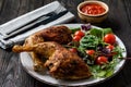 Grilled chicken leg quorters with salad mix and tomatoes. Royalty Free Stock Photo