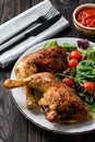 Grilled chicken leg quorters with salad mix and tomatoes. Royalty Free Stock Photo