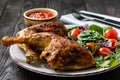 Grilled chicken leg quorters with salad mix and tomatoes. Royalty Free Stock Photo