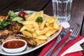 Grilled Chicken Legs with Chips Royalty Free Stock Photo