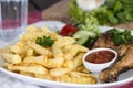 Grilled Chicken Legs with Chips Royalty Free Stock Photo