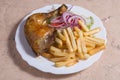 Grilled Chicken Legs with French Fries and Salad Royalty Free Stock Photo