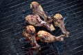 Grilled Chicken legs over hot charcoal grill