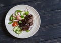 Grilled chicken liver kebabs and fresh vegetable salad Royalty Free Stock Photo