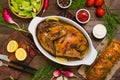 Grilled chicken marinated in balsamic sauce, spicy Italian herbs and fresh lemon. Restaurant supply on a wooden table Royalty Free Stock Photo