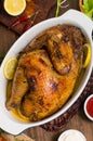 Grilled chicken marinated in balsamic sauce, spicy Italian herbs and fresh lemon. Restaurant supply on a wooden table Royalty Free Stock Photo