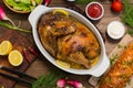 Grilled chicken marinated in balsamic sauce, spicy Italian herbs and fresh lemon. Restaurant supply on a wooden table Royalty Free Stock Photo