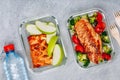 Grilled chicken meal prep containers with rice, broccoli and tomatoes and dessert pie with green apple Royalty Free Stock Photo