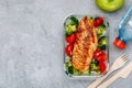 Grilled chicken meal prep containers with rice, broccoli and tomatoes Royalty Free Stock Photo