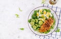 Grilled chicken meat and boiled eggs and fresh cucumber salad. Royalty Free Stock Photo