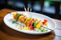 grilled chicken with mixed vegetables on a skewer