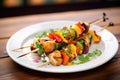 grilled chicken with mixed vegetables on a skewer