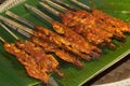 Grilled chicken over banana leaf