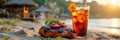 Grilled chicken and refreshing drink at sunset beach picnic Royalty Free Stock Photo