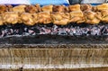 Grilled chicken row on the metal skewer