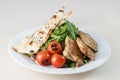 Grilled chicken salad with green spinach leaves