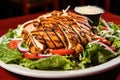 grilled chicken served on a bed of mixed lettuce