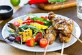 Grilled chicken skewer with salad