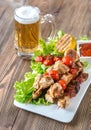 Grilled chicken skewers with mug of beer Royalty Free Stock Photo