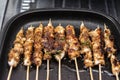 Grilled chicken skewers or sate or satay on a pan