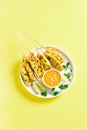 Grilled chicken skewers served with peanut dipping sauce