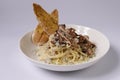 GRILLED CHICKEN Spagetti CARBONARA in a dish top view on grey background singapore food Royalty Free Stock Photo