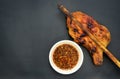 Grilled chicken with Thai style dipping spicy sauce for roasted or grilled food fish sauce and chilli Royalty Free Stock Photo