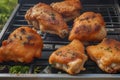 Grilled chicken thighs and vegetables on a grill pan close-up. horizontal top view. Royalty Free Stock Photo