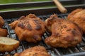 Grilled chicken thighs and vegetables on a grill pan close-up. horizontal top view. Royalty Free Stock Photo