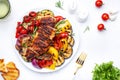 Grilled chicken and various vegetables. Paprika, zucchini, eggplant, mushrooms, tomatoes, onion salad with rosemary on plate, Royalty Free Stock Photo