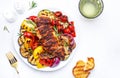 Grilled chicken and various vegetables. Paprika, zucchini, eggplant, mushrooms, tomatoes, onion salad with rosemary on plate, Royalty Free Stock Photo