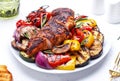 Grilled chicken and various vegetables. Paprika, zucchini, eggplant, mushrooms, tomatoes, onion salad with rosemary on plate, Royalty Free Stock Photo
