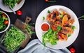 Grilled chicken wings. Baked chicken wings on wooden table.