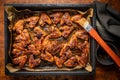 Grilled chicken wings in barbecue sauce in baking tray Royalty Free Stock Photo