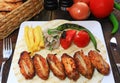 Grilled chicken wings with garnish on wooden Royalty Free Stock Photo